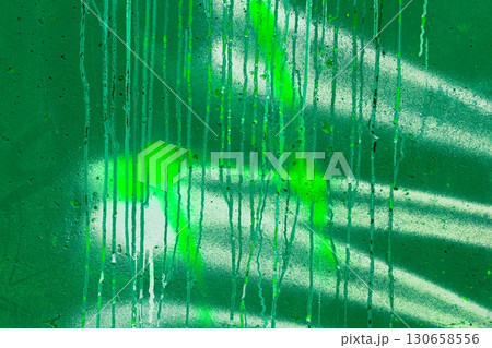 Neon Green Spray Paint Drips on Textured Wall for Urban Y2K Aesthetic 130658556