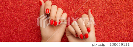 Womans hands with red minimalist nail design. Manicure, pedicure beauty salon concept 130659131