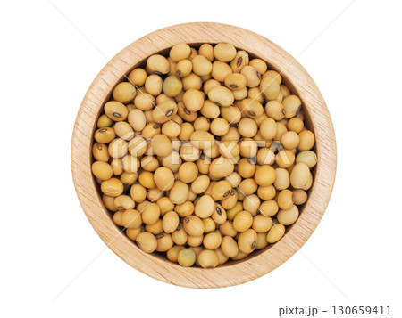 Top view of raw soybeans in a wooden bowl isolated on white background. Perfect for use in healthy eating concepts 130659411
