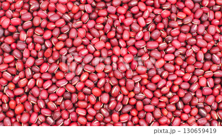 Full frame close-up of red adzuki beans, showing natural texture and color, ideal for food, agriculture, and nutrition concepts. 130659419
