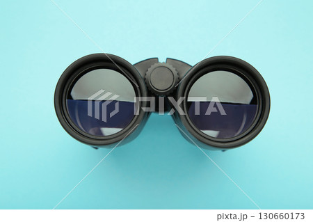 Binoculars on blue background. Top view. 130660173