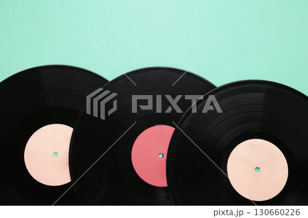 Gramophone vinyl records on mint background. Gramophone vinyl records on mint background. 130660226