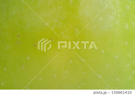 Macro photo of green apple texture as background. Macro photo of green apple texture as background. 130661410