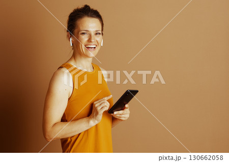 Cheerful Woman Interacting with Smartphone 130662058