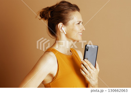 Smiling Woman Listening on Smartphone in Profile 130662063
