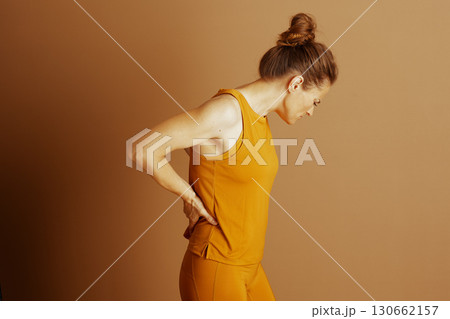 Woman Experiencing Lower Back Pain 130662157