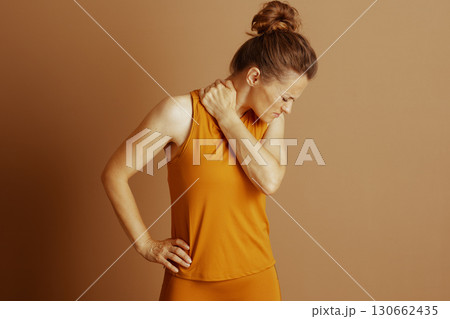 Woman Massaging Painful Neck and Shoulder 130662435
