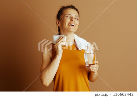 Happy Woman Wiping Sweat Post-Workout Happy Woman Wiping Sweat Post-Workout 130662442