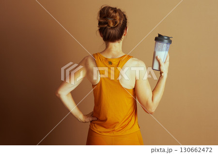 Active Woman in Racerback Top, From Behind Active Woman in Racerback Top, From Behind 130662472
