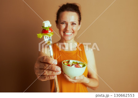 Woman with Mint Green Salad Bowl and Fork Woman with Mint Green Salad Bowl and Fork 130662553