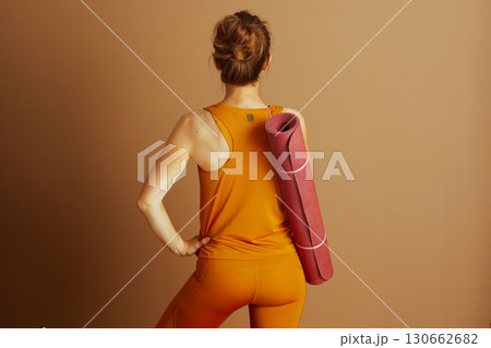 Confident Woman Ready for Yoga, Back View 130662682