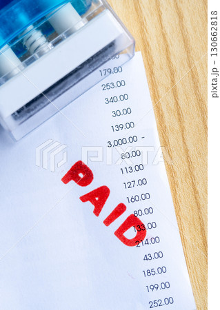 Paid Stamp on Financial Receipt Document Close Up 130662818