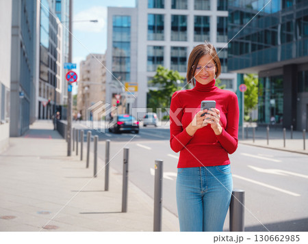 Woman in glasses stands in center of Frankfurt, Woman in glasses stands in center of Frankfurt, 130662985