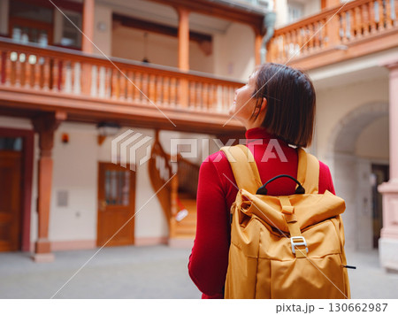 woman walks through old town of Frankfurt 130662987
