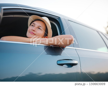 Traveler woman drives car through scenic countryside of Croatia Traveler woman drives car through scenic countryside of Croatia 130663009