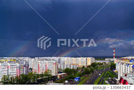 Double rainbow over city buildings after rain Double rainbow over city buildings after rain 130663437