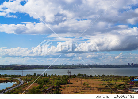 Picturesque natural and industrial landscape under wonderful cumulus clouds 130663483