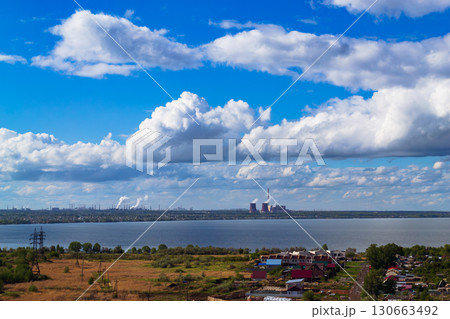 Power plant by lake under bright beautiful clouds 130663492