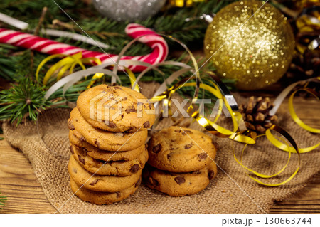 Chocolate chip cookies with Christmas decoration on wooden table 130663744
