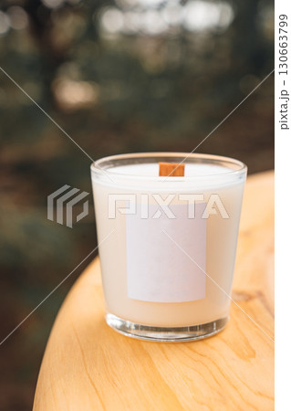 Scented candles on a wooden table. Scented candles on a wooden table. 130663799