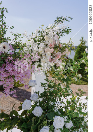 the area of a wedding ceremony on the banks with columns and flowers. 130663828