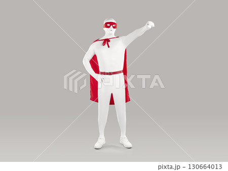 Portrait of faceless unrecognizable person in a superman pose wearing a red cloak. Portrait of faceless unrecognizable person in a superman pose wearing a red cloak. 130664013