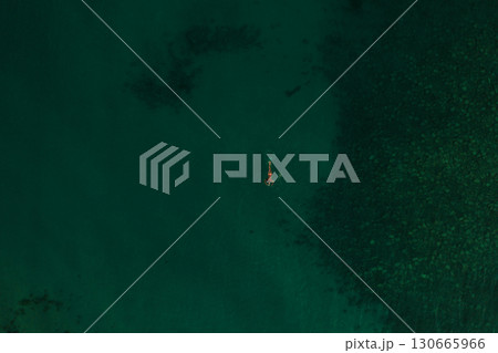 Aerial top nature view above green turquoise Thracian sea Greece Ellada. Beautiful woman bikini Aerial top nature view above green turquoise Thracian sea Greece Ellada. Beautiful woman bikini 130665966