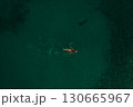 Aerial top nature view above green turquoise Thracian sea Greece Ellada. Beautiful woman bikini  130665967