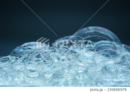 Beautiful foam texture in blue tones. Bubbles of detergent or bubble bath. Beautiful foam texture in blue tones. Bubbles of detergent or bubble bath. 130666976