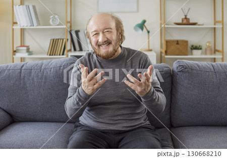 Senior old man happy home talk chat online video call with diverse friends, having webcam conference Senior old man happy home talk chat online video call with diverse friends, having webcam conference 130668210