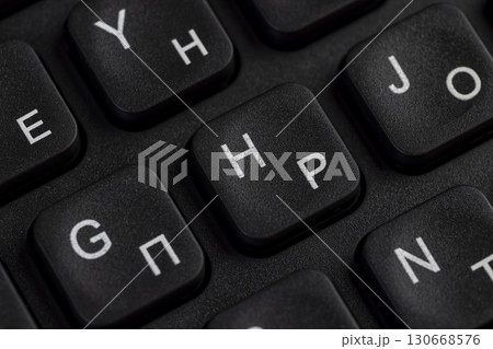 keyboard with Russian and English letters, computer keyboard layout with Latin and Cyrillic alphabet, close up 130668576