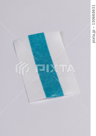 one band made of woven fabric with a strip of treated green liquid for wound disinfection, a long band that can be cut into pieces according to the size of the wound, a soft strip with disinfectant 130668631