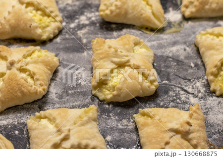 Close up shot of the cottage cheese pastries on the baking tray. Food 130668875