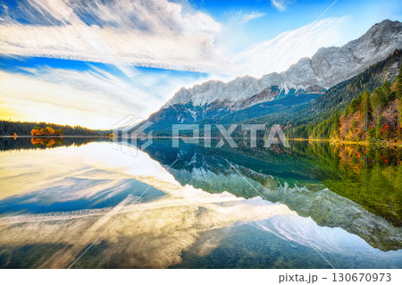 Amazing autumn landscape of Eibsee Lake in front of Zugspitze summit under sunlight. 130670973