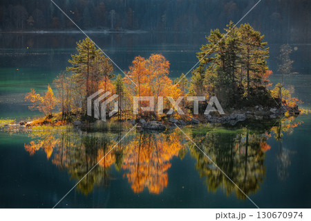 Amazing autumn  landscape of islands with pine-trees in the middle of Eibsee lake. 130670974