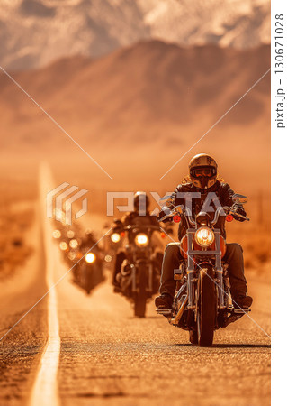Modern bikers ride along the highway in a large group on a scorching hot day Modern bikers ride along the highway in a large group on a scorching hot day 130671028