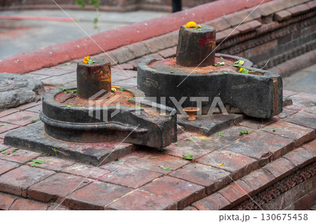 Shiva Lingam with Yoni base in Pashupatinath temple the most holy Hinduism places in Kathmandu, Nepal. Shiva Lingam is a powerful symbol of Lord Shiva in Hinduism. 130675458