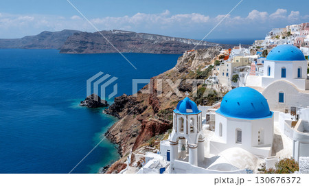 Santorini Blue Domed Churches and Stunning Aegean Sea View on Greek Island Cliffside Village 130676372