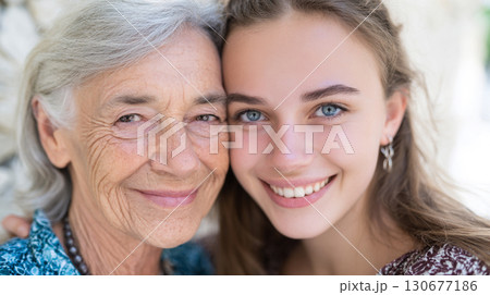 Happy Family Embracing Across Generations with Warm Smile and Love 130677186