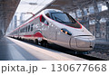 Modern high-speed train stands at station platform, ready for departure 130677668
