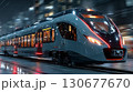 Modern high-speed train stands at station platform, ready for departure 130677670