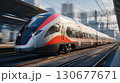Modern high-speed train stands at station platform, ready for departure 130677671