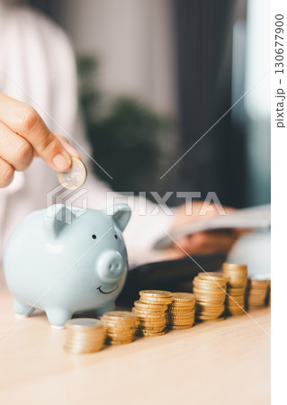 Hand holding coin symbolizes saving, investment, smart finance decisions money, currency, cash financial wealth, driving business growth, economic stability, long-term success in banking economy. 130677900