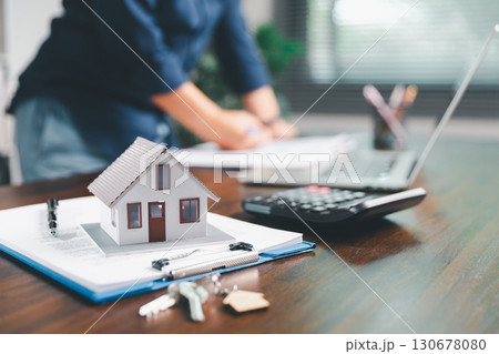 Female hand holds small miniature toy house, symbolizing woman dream of moving into her own home-real estate concept represents property investment, mortgage planning, insurance for secure future. Female hand holds small miniature toy house, symbolizing woman dream of moving into her own home-real estate concept represents property investment, mortgage planning, insurance for secure future. 130678080