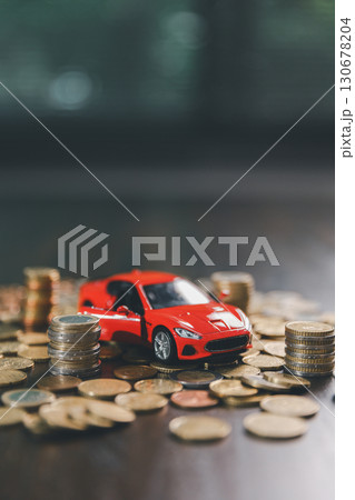 Euro car finance. car with calculator and money on wood table. insurance concept. investment and wealth accumulation through the symbolism of miniature car alongside coins. Euro car finance. car with calculator and money on wood table. insurance concept. investment and wealth accumulation through the symbolism of miniature car alongside coins. 130678204