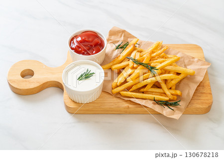 French fries with sour cream and ketchup French fries with sour cream and ketchup 130678218