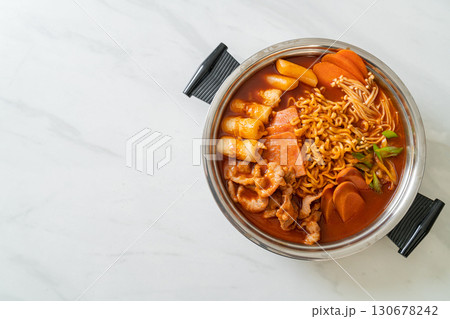 Budae Jjigae or Budaejjigae (Army stew or Army base stew). It is loaded with Kimchi, spam, sausages, ramen noodles and much more 130678242