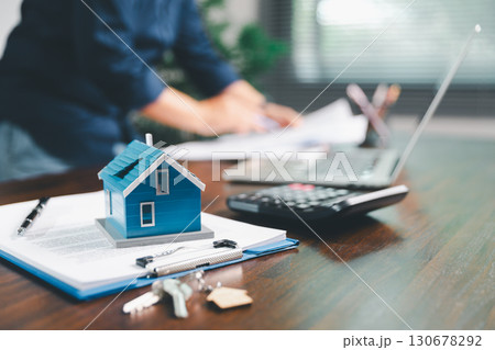Female hand holds small miniature toy house, symbolizing woman dream of moving into her own home-real estate concept represents property investment, mortgage planning, insurance for secure future. Female hand holds small miniature toy house, symbolizing woman dream of moving into her own home-real estate concept represents property investment, mortgage planning, insurance for secure future. 130678292