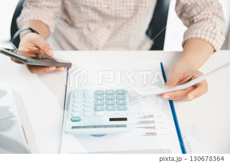 Woman calculating monthly home expenses, taxes, bank account balance and credit card bills payment, Income is not enough for expenses. financial planning, business calculate tax, investment finance. Woman calculating monthly home expenses, taxes, bank account balance and credit card bills payment, Income is not enough for expenses. financial planning, business calculate tax, investment finance. 130678364
