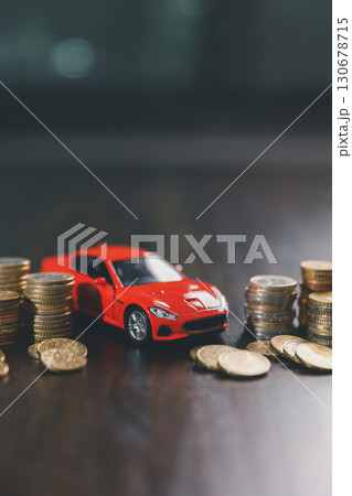 Euro car finance. car with calculator and money on wood table. insurance concept. investment and wealth accumulation through the symbolism of miniature car alongside coins. 130678715